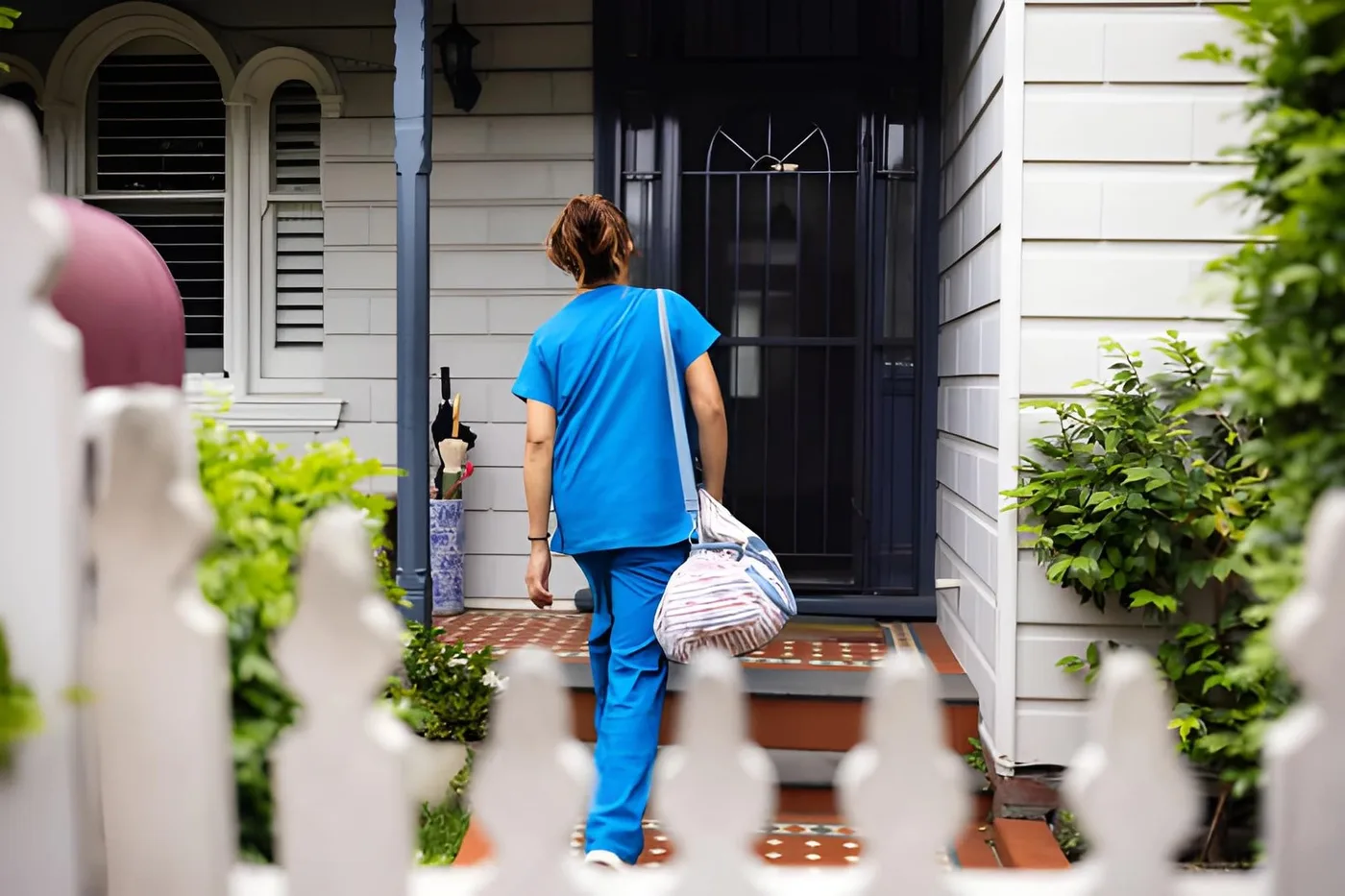 A caregiver arriving at a client’s home